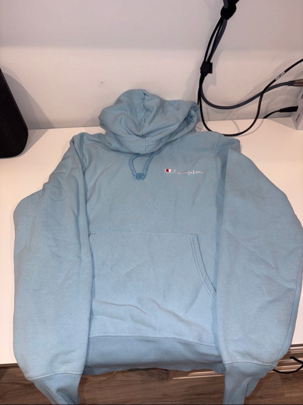 Champion Light Blue Pullover Hoodie with Embroidered Script